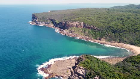 Drone-pan-shot-over-Bouddi-National-Park-headland-coastline-of-Little-Beach-Macmasters-NSW-Central-Coast-Australia-3840x2160-4K