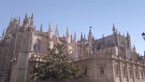 Dolly-in,-Breathtaking-Cathedral-Exterior-in-Seville,-Spain,-Wide-Shot