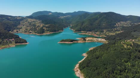 Aerial-drone-shot-over-gorgeous-Zaovine-lake-and-Tara-mountain-in-Serbia
