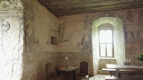 Decorated-Walls-Inside-Inside-medieval-Castle-Torpa-Stenhus,-Pan