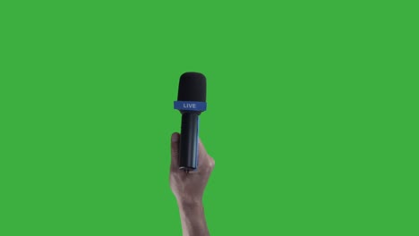 Hand-holding-Microphone-For-Live-Press-Conference-interview-with-green-screen