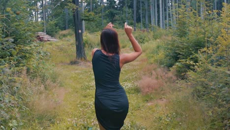 Gorgeous-Woman-Enjoying-Nature-in-forest-Dancing-Barefoot---Full-body-Shot