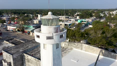 Extreme-closeup-orbiting-view-of-lighthouse-in-Telchac-Puerto,-Yucatan,-Mexico
