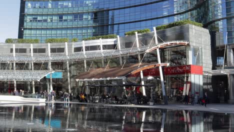 Heart-of-the-piazza-gae-aulenti-financial-district-buildings-in-Milan-Italy-with-the-refleecting-water-and-shops