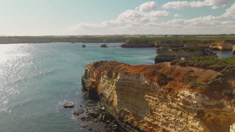 4k-Aerial-high-rocky-cliff-on-the-ocean-Drone-truck-right-to-left-shot