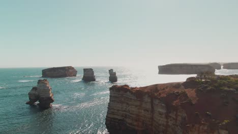 4k-Aerial-Big-rocks-in-ocean-near-coast-Drone-truck-left-to-right-shot