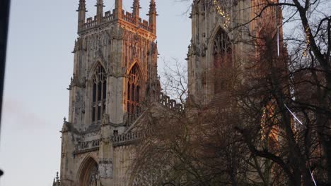 Tight-rising-shot-fo-the-two-towers-of-York-Minster-during-an-orange-sunrise