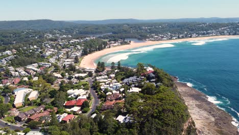 Aerial-drone-beautiful-landscape-shot-suburb-of-houses-in-Avoca-beach-Winnie-Bay-headland-Copacabana-Central-Coast-tourism-Ocean-waves-NSW-Australia-4K