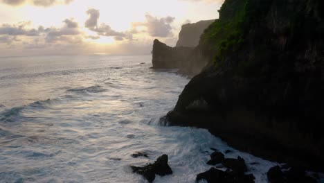 Silhouette-of-majestic-cliffs-beside-coastline-of-beach