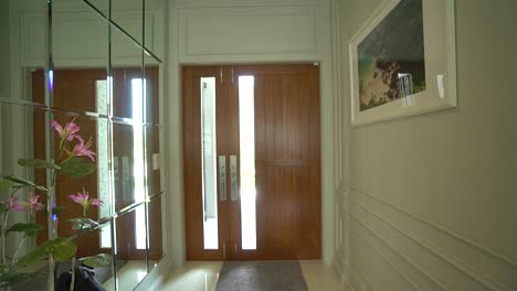 Elegant-Big-Wooden-Door-Hallway-with-Mirror-Wall