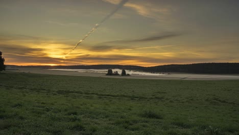 time-lapse-of-sunrise-over-field-with-lake