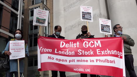 Solidarity-protestors-outside-London-Stock-Exchange-hold-banners-that-say,-“De-list-Global-Coal-Management-now”-on-the-14th-anniversary-of-three-killed-during-demonstrations-in-Phulbari,-Bangladesh