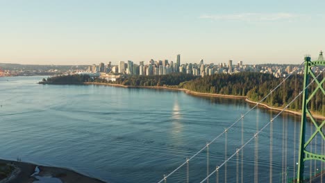 Drone-Aerial-Shot-flying-towards-Vancouver-cityscape-passing-the-Lions-Gate-Bridge