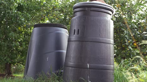 Compost-bins-in-a-summer-garden-medium-panning-shot