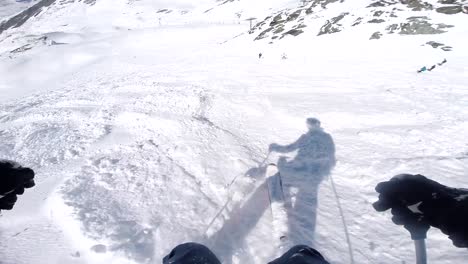 PoV-of-man-skiing-off-piste-down-challenging-slope-with-heavy-snow-in-France,-Val-Thorens