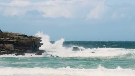 Huge-waves-crash-on-the-rock-faces-in-slow-motion-at-north-bondi-sydney-australia