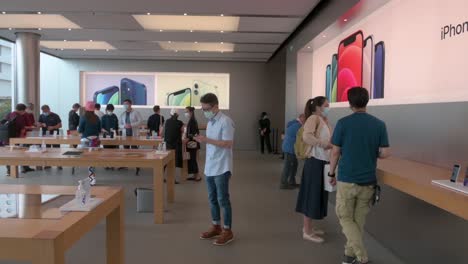 Customers-testing-and-purchasing-Apple-brand-products-at-an-Apple-store-during-the-launch-day-of-the-new-iPhone-12-and-iPhone-12-Pro-phones