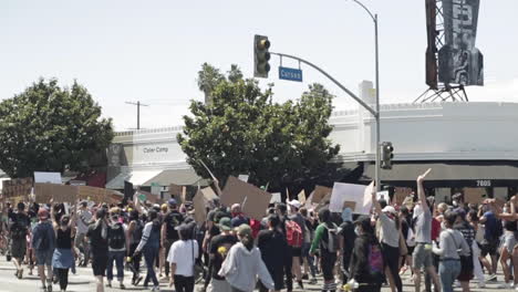 Black-Lives-Matter-Protestors-March-Down-LA-Street-Into-the-Distance,-Slow-Motion