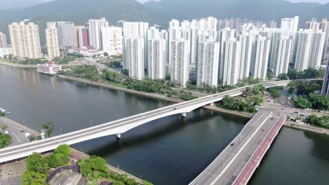 Luftaufnahme-Von-Hong-Kong-Sha-Tin-Mega-Wohngebäuden-Mit-Lion-Rock-Mountains-Im-Hintergrund