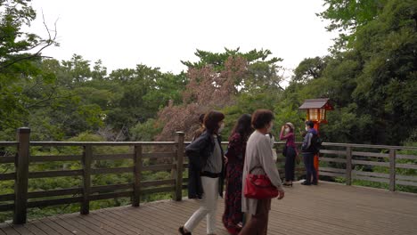 Crowd-of-Japanese-tourists-wearing-facemask-at-observation-deck-in-park-during-Corona-Pandemic