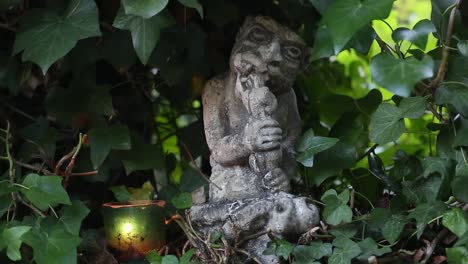 Candle-next-to-Gnawing-Gargoyle-in-Carmel-Patio