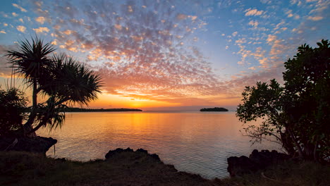 Peaceful-vibrant-day-to-night-timelapse-over-a-secluded-bay-of-Isle-of-Pines,-New-Caledonia