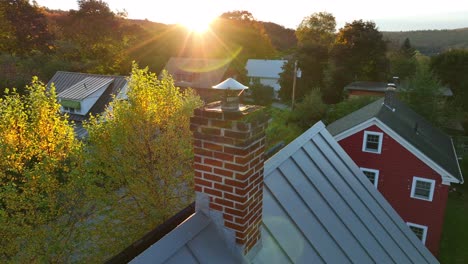 Red-brick-chimney-on-home-rooftop-Aerial-in