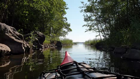 Kayak-floating-in-river,-Vibrant-Nordic-Nature