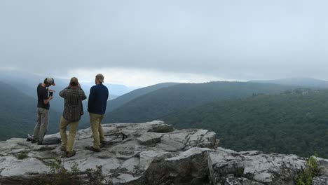 Three-men-stand-at-the-Rohrbaugh-Cliffs-in-the-Dolly-Sods-Wilderness,-part-of-the-Monongahela-National-Forest-in-West-Virginia