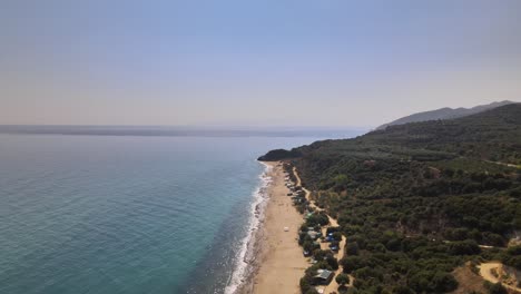 Aerial-drone-clip-over-a-beautiful-beach-in-Kavala,-Macedonia,-Greece