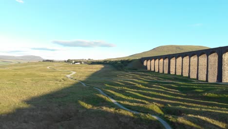 Time-lapse-of-green-wide-meadows-by-Ribblehead-Viaduct,Yorkshire,-sunny-day