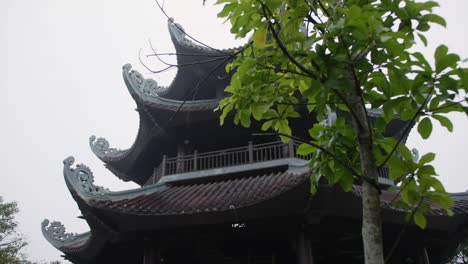 Ancient-Temple-Tower-Roof-Exterior-At-Spiritual-Complex-In-Trang-An,-Bai-Dinh-Pagoda,-Ninh-Bình-Province,-Vietnam