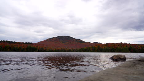 Left-to-right-pan-by-a-lake-with-mountain
