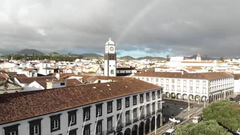 Ponta-Delgada-city-center-in-an-overcast-day-in-São-Miguel-Island,-Azores,-Portugal---Crane-up-panoramic-Aerial