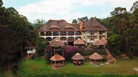 Scenic-View-Of-Birdnest-Resort-In-Kabale,-Lake-Bunyonyi,-Uganda---aerial-pullback