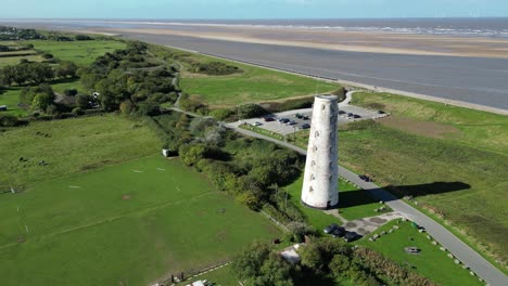 Leasowe-Lighthouse-aerial-drone-pan-coastline-reveal-on-a-sunny-afternoon