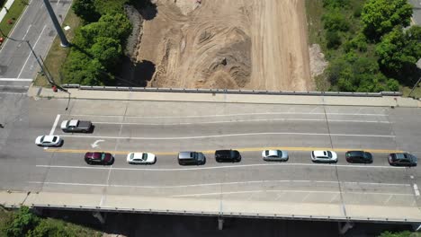 496-highway-construction-in-Lansing,-Michigan-with-drone-video-moving-back-overhead