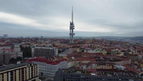 Ascending-aerial-drone-view-of-Prague-and-Zizkov-Tower,-city-panorama,-capital-of-Czech-Republic