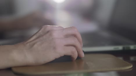 Closeup-shot-of-woman's-hand,-clicking-her-mouse