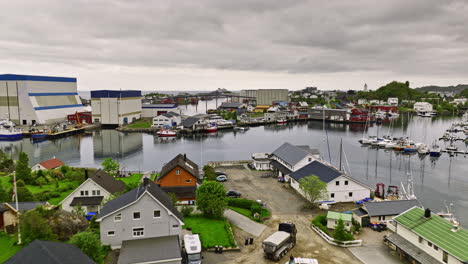 Svolvær-Norway-v1-cinematic-low-level-drone-flyover-waterfront-neighborhood-capturing-red-rorbuer-situated-on-small-island-in-the-harbor-close-to-the-town-center---Shot-with-Mavic-3-Cine---June-2022