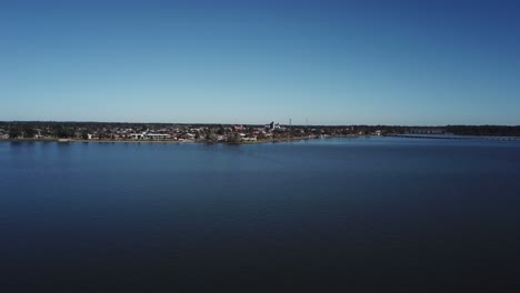 Drone-aerial-over-dark-blue-lake-in-Yarrawonga-on-a-sunny-summers-day