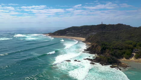 Wide-revealing-drone-shot-of-Wategos-Beach-in-Australia-in-Byron-Bay