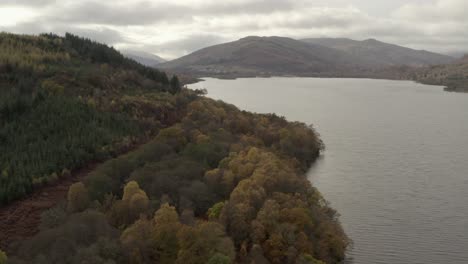 An-aerial-view-looking-down-Loch-Tay-on-an-autumn-day,-Stirling,-Scotland
