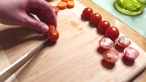 Knife-cutting-small-salad-tomatoes
