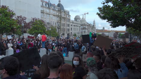 Porto-Portugal---june-6th-2020:-BLM-Black-Lives-Matter-Protests-Demonstration-man-adresses-the-cheering-crowd-with-a-microphone-in-his-hand-wide-angle