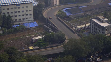 timelapse-motion-laps-S-bridge-mandlik-bridge-nm-joshi-marg-Planet-Godrej-Byculla-zoo-Mumbai-India-Maharashtra-train-tracks-Mumbai-local-public-transport-top-view-bridge-close-up