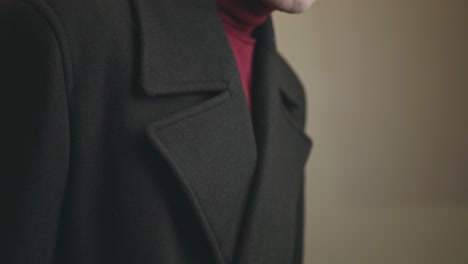 Man-Wearing-A-Neat-Charcoal-Gray-Double-Breasted-Wide-Notch-Lapel-Overcoat---Closeup-Shot