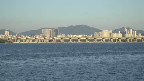Distant-Jamsil-Bridge-crossing-Han-River-in-city-of-Seoul-on-sunny-day