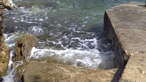 Waves-hitting-concrete-stairs-in-an-alcove-on-Mljet-Island-Croatia-in-the-Adriatic-Sea