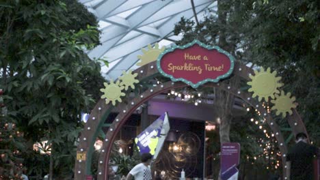 Christmas-Greeting-Sign-At-The-Scenic-Canopy-Park---Christmas-During-Pandemic-At-Jewel-Changi-Airport-In-Singapore---revealing-shot,-slow-motion